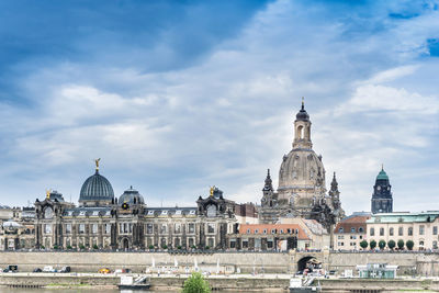 Historic buildings in city against sky