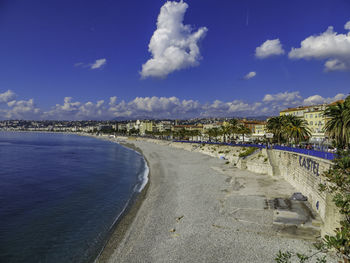 Panoramic view of beach against blue sky