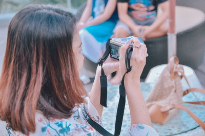 Woman photographing with mobile phone