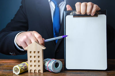 Midsection of businessman working in office