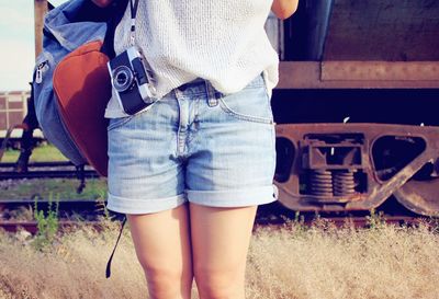 Low section of woman standing outdoors