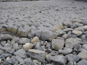 Stones on sand at beach