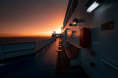 Deck of ferry sailing across the sea during last moments of a beautiful sunset