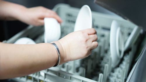 Close-up of hands on metal