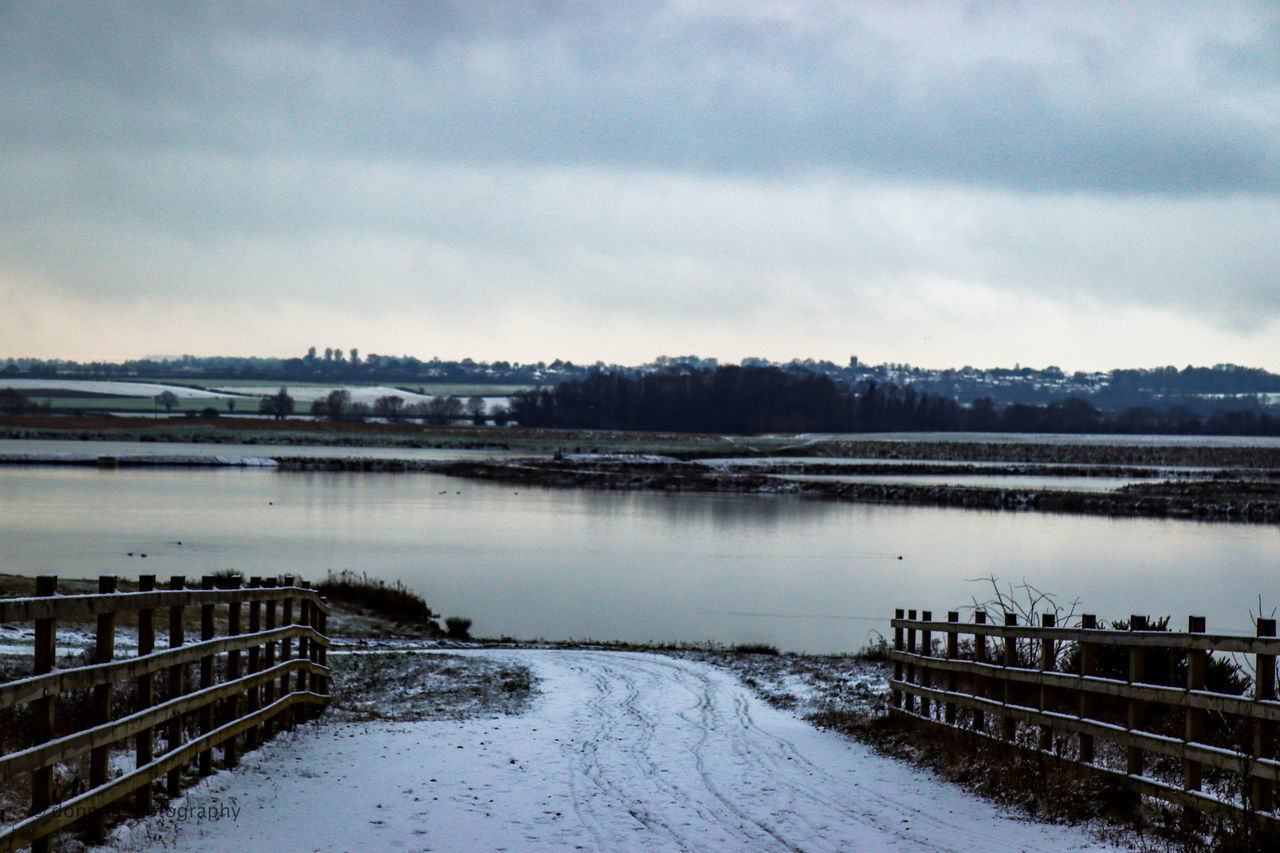 VIEW OF LAKE AGAINST SKY DURING WINTER