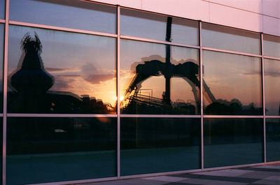 Silhouette of building against sky during sunset