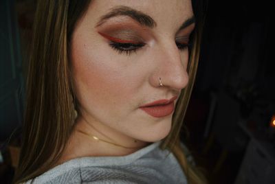 Close-up of beautiful young woman with make-up