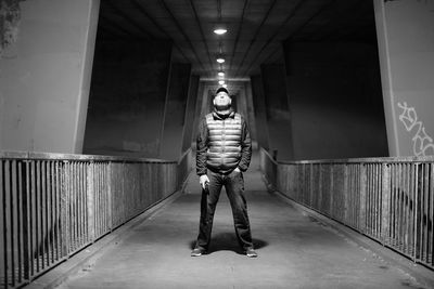 Man standing in illuminated building