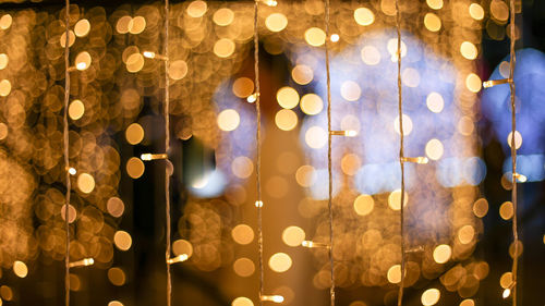 Close-up of illuminated string lights at night