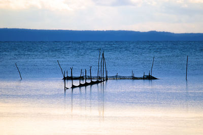 Scenic view of sea against sky at sunset