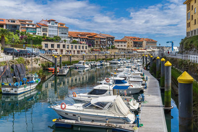 Boats moored at harbor