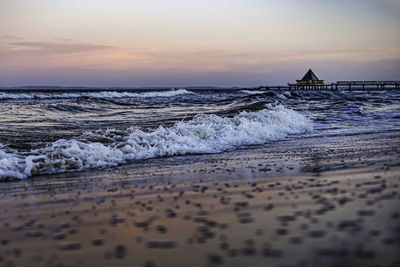 Scenic view of sea against sky during sunset