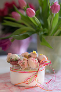 Close-up of pink roses on table