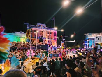 Group of people in front of building at night