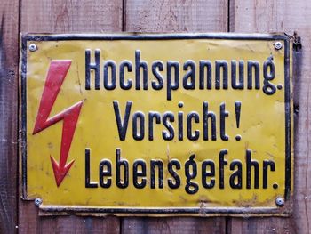 Close-up of warning sign on wall