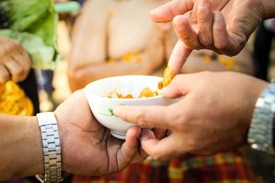 Close-up of man holding ice cream
