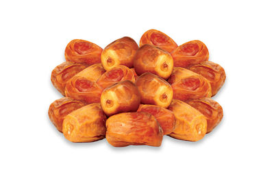 Close-up of bread in plate against white background