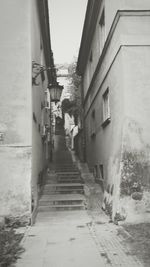 Street amidst houses against sky