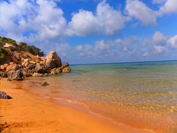 Scenic view of sea against cloudy sky