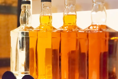 Close-up of wine bottles on table