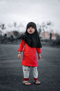 Portrait of girl standing in snow