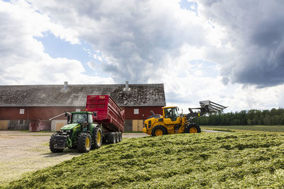 Machinery preparing silage