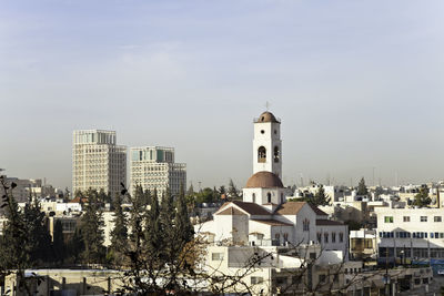 View of buildings in city against sky