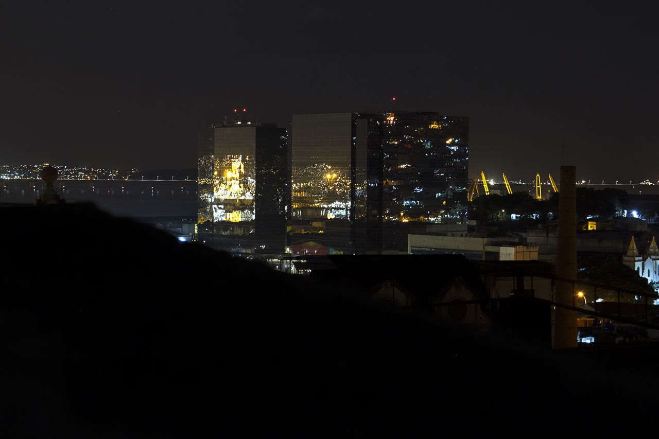 ILLUMINATED CITYSCAPE AT NIGHT