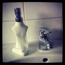 Close-up of faucet in bathroom