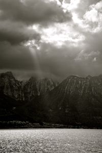 Scenic view of mountains against cloudy sky