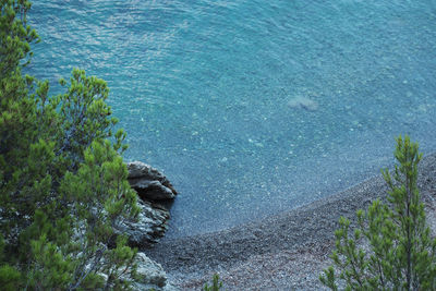 High angle view of rocks by sea