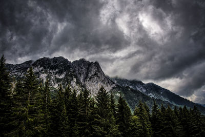 Scenic view of mountains against cloudy sky