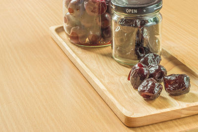 Close-up of fruits in jar on table