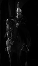 Close-up of candle against black background