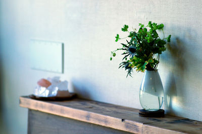 Flower vase on table at home