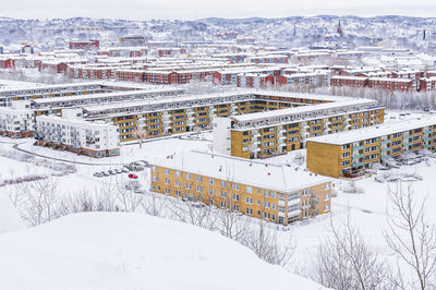 Residential buildings in city at winter