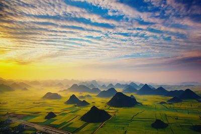 Scenic view of landscape against sky during sunset