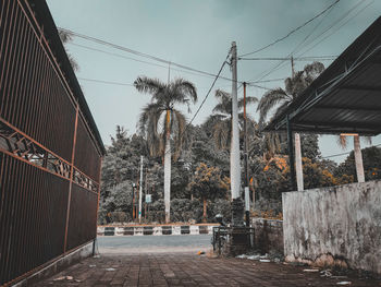 Street amidst buildings against sky