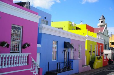 Multi colored buildings against sky