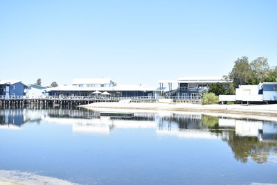 Built structures against clear blue sky