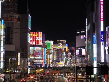 City street amidst illuminated buildings at night