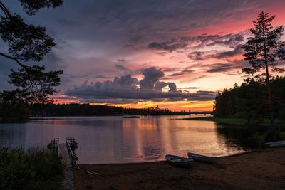 Scenic view of lake against orange sky