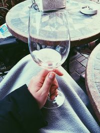 Close-up of hand holding glass of water