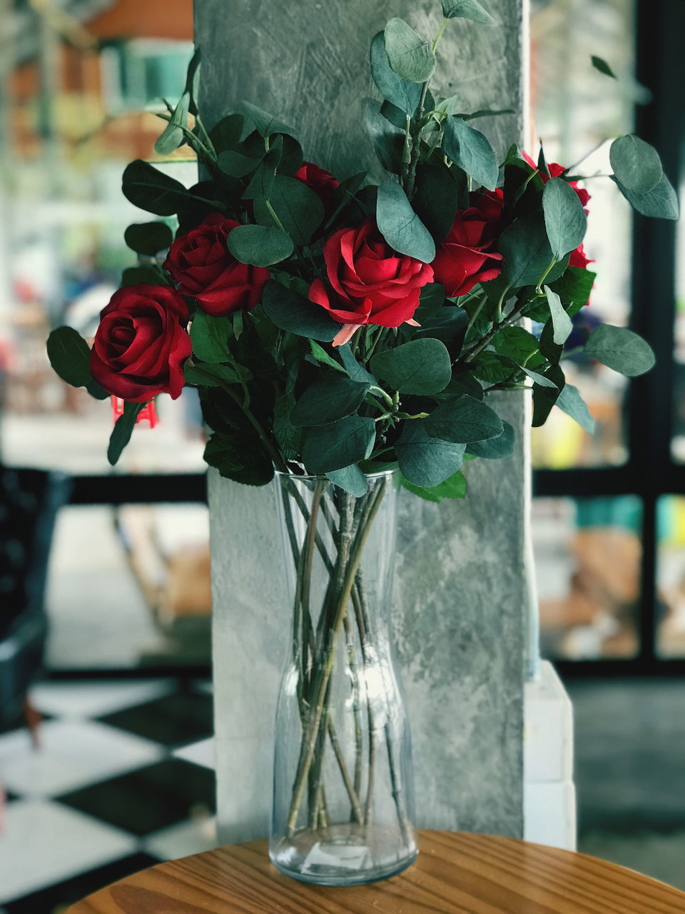 CLOSE-UP OF RED ROSE BOUQUET ON TABLE