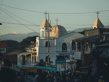 Group of people in front of buildings in city
