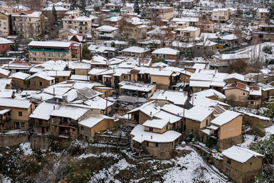 High angle view of snow covered buildings