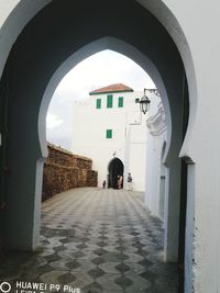 Empty alley amidst buildings