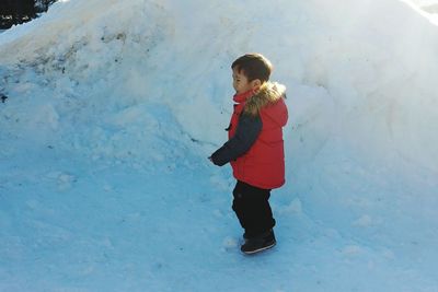 Full length of woman standing in snow