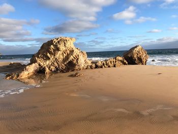 Scenic view of beach against sky