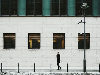 Woman standing in front of building